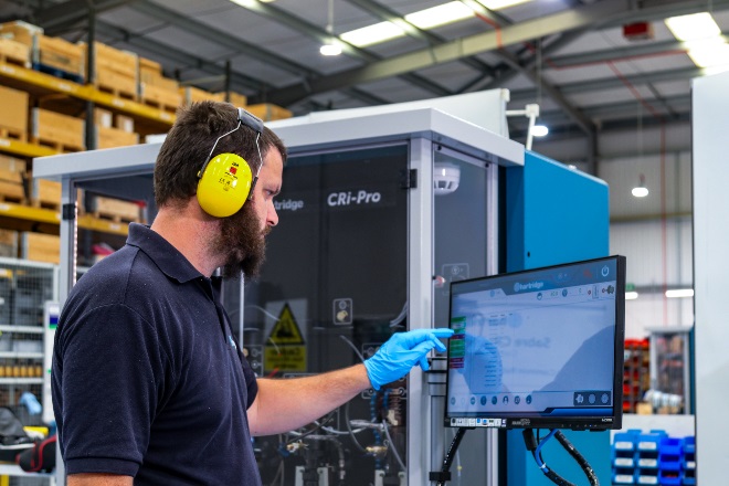 engineer pointing at screen in test bench
